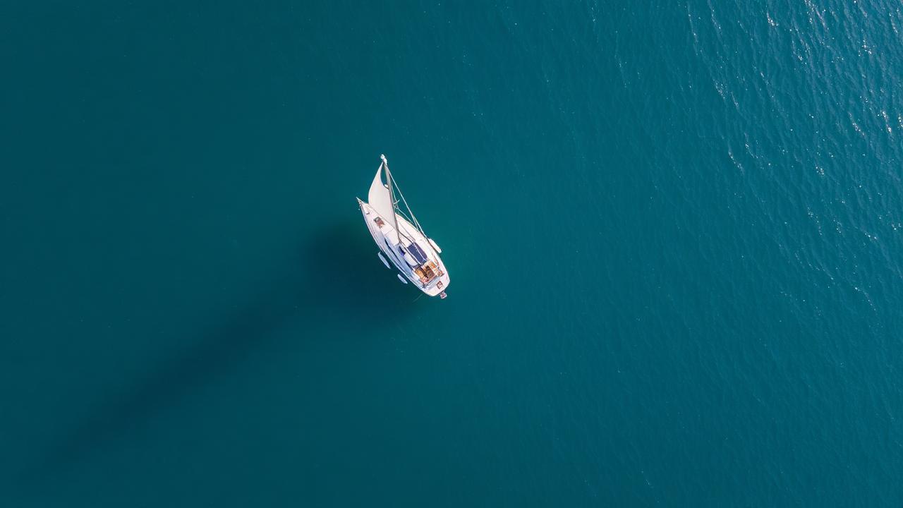 Aerial view of a sailboat on open water